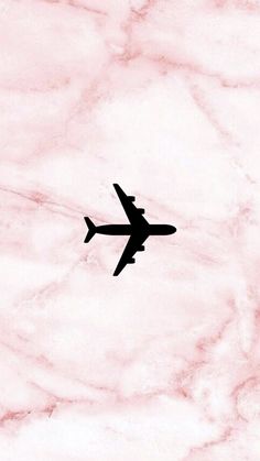 an airplane is silhouetted against a marble background