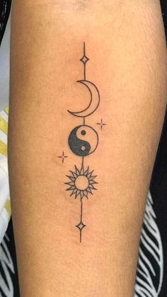 a person with a tattoo on their leg that has a sun and moon in it