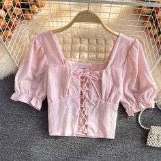 Cute puff sleeve top lace up topsMaterial: blendedColor: pink, yellow, purple, white, blackSize(cm): free sizelength 42 bust 90 Pink Feminine Crop Top With Puff Sleeves, Pink Puff Sleeve Feminine Crop Top, Feminine Pink Puff Sleeve Crop Top, Trendy Pink Puff Sleeve Crop Top, Pink Square Neck Crop Top For Spring, Trendy Pink Crop Top With Square Neck, Casual Pink Puff Sleeve Crop Top, Chic Pink Puff Sleeve Top With Square Neck, Feminine Pink Blouse With Square Neck