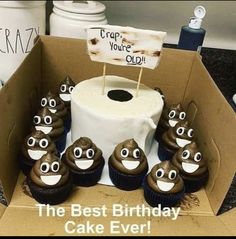 a box filled with cupcakes covered in chocolate frosting and topped with googly eyes