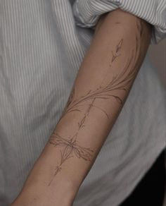 a person with a tattoo on their arm