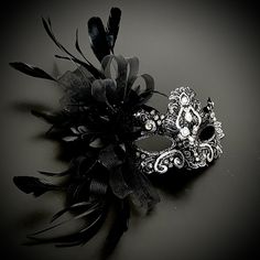 Feathers,rhinestones and floral complement the fashionable apparatus - the black silver race mask - to any function.