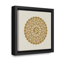 a gold and white flower with an omen symbol in the center on a beige background