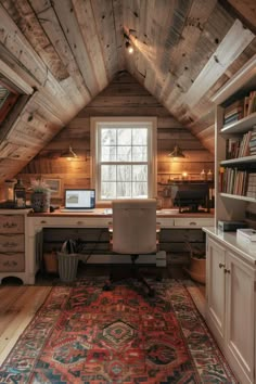 an attic home office with wood walls and ceiling, built into the side of the house