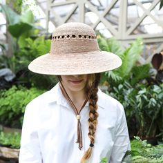 An asymmetrical brim makes this hat ideal for a day spent in the sun, each one hand-woven using sustainable palm fibers and finished with a suede strap. Garden Boots, Gardening Outfit, Gardening Gloves, Sun Hat, Hot Cars, Bandanas, Straw Hat, Wooden Beads, Cleaning Clothes