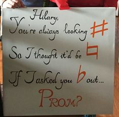 a woman holding up a sign that says sorry you're always looking so though it be if i asked you out prom