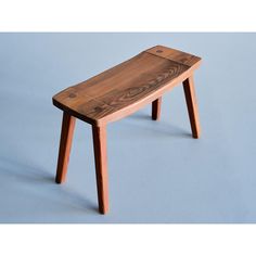 a wooden bench sitting on top of a blue floor