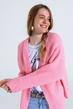 Introducing our Oversized Fluffy Knit Open Cardigan in Pink– a cozy and stylish addition to your wardrobe, perfect for the coldest days of Spring. This open cardigan is crafted from a very fluffy and soft knit, featuring a ribbed design at the hem and cuffs for added texture and warmth.  Made from a blend of 70% Polyester, 21% Polyamide, 8% Wool, and 1% Elastane, this cardigan offers a luxurious feel while ensuring comfort during chilly weather. The oversized fit and open design make it a versatile piece that can be effortlessly paired with jeans or dresses.  The model, wearing size S, exemplifies the regular fit, showcasing the cardigan's adaptability for various styling options. With a height of 5'9'' and measurements of 33-24-35, the S-M sizing corresponds to US sizes 4 and 6, providing Cardigan Sleeves, Tan Scarf, Fluffy Knit, The Cardigans, Skirt Jumpsuit, Open Knit Cardigan, Scarf Headband, Pink Cardigan, Open Design