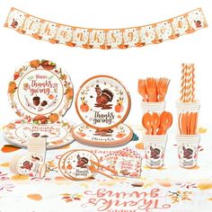 a thanksgiving themed table setting with turkey plates and paper straws