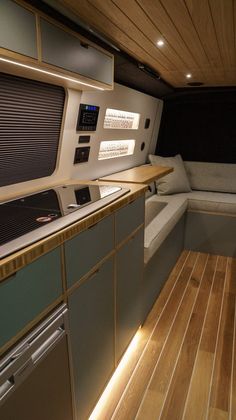 the interior of a boat with wood flooring