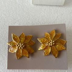 Vintage Avon, Yellow Gold With Glitter Poinsettia Pierced Earrings. These Are New In The Box Of Vintage Airings From The 80s. They Would Make A Great Addition To Your Holiday Earring Collection. Festive Gold Glitter Jewelry, Gold Flower Earrings For Festive Occasions, Poinsettia Earrings, Yellow Glitter, Earring Collection, Avon Jewelry, Holiday Earring, Vintage Avon, Earrings Collection