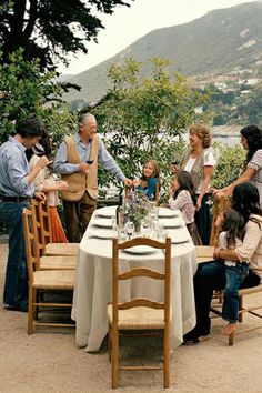 a group of people sitting around a table