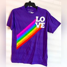 Love Tee * Pride Collection * Purple With Rainbow T-Shirt * Unisex Tee * Men’s Cut S * Short Sleeve 100% Cotton White Lettering With Big Rainbow Men’s Size Small Nwt - New And Unworn. Mailed From A Smoke-Free & Pet-Free Home Office. Bundle Items To Save On Shipping! Casual Pride Crew Neck T-shirt, Casual Crew Neck T-shirt For Pride, Pride Graphic Print Crew Neck Top, Rainbow Short Sleeve Top For Pride, Short Sleeve Shirt With Graphic Print For Pride, Casual Cotton T-shirt For Pride, Pride Text Print Short Sleeve Top, Pride Cotton Tops With Graphic Print, Pride Graphic Print Cotton Tops