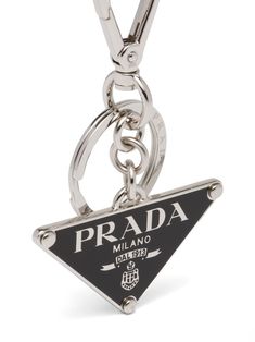 triangle-logo keyring from PRADA featuring silver-tone, black, metal, logo lettering, triangle shape and signature Air Jordan Wings logo keyring. Luxury Logo Charm, Chains Men, Jordan Wings, Prada Mini, Plaque Design, Trendy Shoes Sneakers, Wings Logo, White Accessories, Metal Keychain