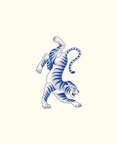 a blue and white tiger leaping up into the air