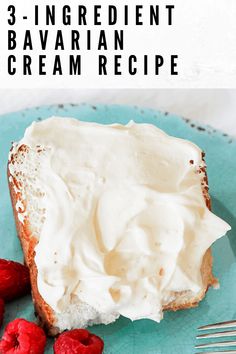 a piece of bread with whipped cream on top and raspberries next to it