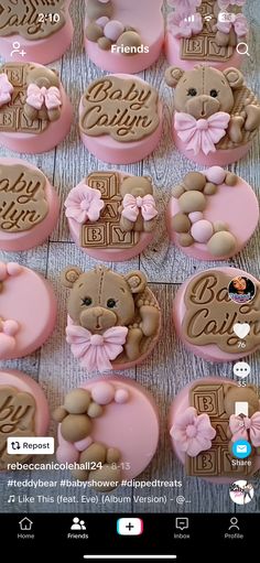 teddy bear cookies are arranged on a table with pink icing and brown fondant