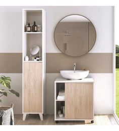 a white sink sitting under a round mirror next to a wooden cabinet with shelves on it