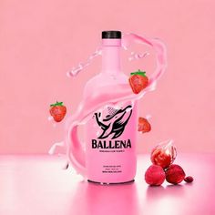 a bottle of ballena with strawberries falling into it