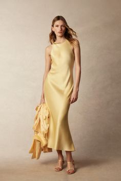 Delicate details, pastel hues, and fluid silhouettes.

This season, our timeless Polo Ralph Lauren Bias-Cut Double-Faced Satin Gown is elevated in a lemon-yellow hue for effortless #PoloRLStyle. Ralph Lauren Clothes, Yellow Satin Dress, Madras Dress, Knit Polo Dress, Cotton Wrap Dress, Ralph Lauren Fall, Boat Neck Dress, Women's Outfits, Polo Ralph Lauren Women