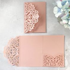 two pink cards with laser cut designs on them