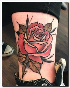 a rose tattoo on the leg