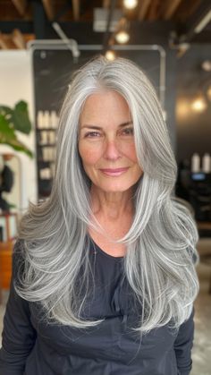 More and more women are embracing their natural gray hair and experimenting with stunning long hairstyles that showcase their silver strands. Whether you’re transitioning to gray hair, have fully embraced your silver strands, or simply Platinum Grey Hair Silver, Long Grey Hair With Bangs, Long Gray Hair With Bangs, Spiral Perm Long Hair, Long Gray Hair Styles, Wendy Hair, Transitioning To Gray Hair, Grey Transition