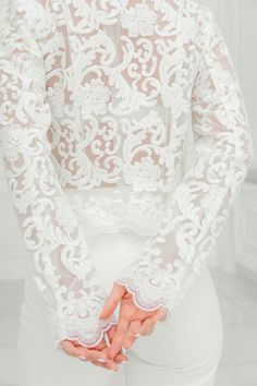 This is a beautiful bridal jacket made with high quality lace. This elegant lace wedding coat closures with a zip on the front. A wedding dress cover up ensures that no detail is forgotten. A bridal lace top can not only be the perfect thing to cover up and stay warm, it can also be a very luxurious compliment to your overall look. COLOR: - Cream White (Ivory) SIZE: Bust Waist Hips S 34.64 inch / 88 cm 25.19 inch/ 64 cm 36.22 inch/ 92cm M 36.22 inch/ 92 cm 26.77 inch/ 68 cm 37.79 inch/ 96cm L 37 Elegant Wedding Gown With Delicate Lace, Elegant Embroidered Lace Wedding Dress, Elegant Mother Of The Bride Gown With Delicate Lace, Elegant White Mother Of The Bride Gown, Elegant White Gown For Mother Of The Bride, Elegant Embroidered Wedding Dress For Reception, Elegant Fitted Wedding Dress With Delicate Lace, Wedding Gown With Lace Sleeves, Fitted Long Sleeve Gown For Reception