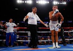 two men standing next to each other in a boxing ring