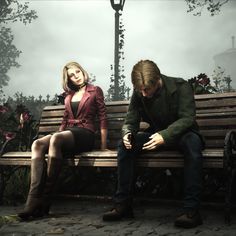 a man and woman sitting on a park bench