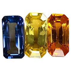 three different colored diamonds are shown side by side on a white background, one is yellow and the other is blue