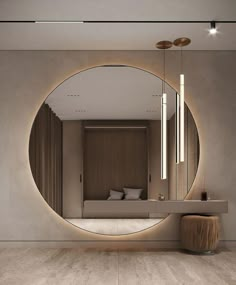 a large round mirror in the middle of a room