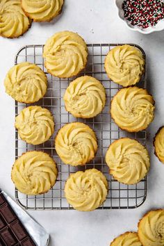 freshly baked frosted cupcakes on a cooling rack