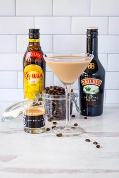 the martini is ready to be served with coffee beans