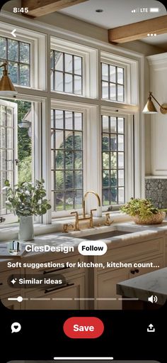 an image of a kitchen with windows in the middle and plants on the counter top