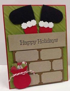 a handmade card with two black and red hats on top of a brick wall