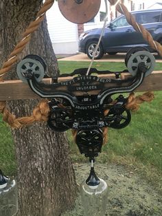 an old fashioned wind chime hanging from a tree