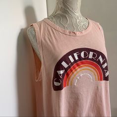 Very Cool Draped Open Back Muscle Tank Top. Retro California Graphic. Light Peach Color. Loose Fit. 100% Cotton Size Medium Approx Measurements Taken Flat Pit To Pit 21” Length In Front 23” Arm Opening 11” Brand New With Tags. /Aa Summer Graphic Print Tops For Loungewear, Casual Sleeveless T-shirt For Loungewear, Summer Graphic Print Tops For Everyday, Soft-washed Relaxed Fit Muscle Tee For Summer, Summer Soft-washed Relaxed Fit Muscle Tee, Summer Soft-washed Relaxed Muscle Tee, Graphic Tee Tank Top With Relaxed Fit For Spring, Oversized Casual Muscle Tee For Spring, Sleeveless Graphic Print Tops For Loungewear