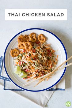 thai chicken salad on a white plate with chopsticks