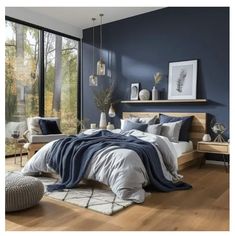 a bedroom with blue walls and wooden floors