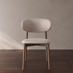 a white chair sitting on top of a wooden floor