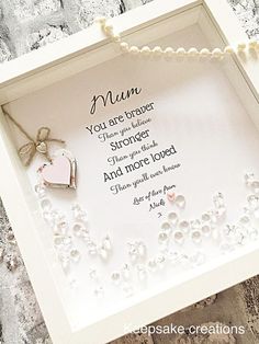 a mother's poem in a white frame with pearls and a heart on it