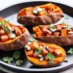 baked sweet potatoes with herbs on a plate