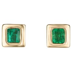 Elevate your style with our exquisite bezel-set emerald earrings, each showcasing mesmerizing Colombian emeralds with a medium vivid green hue and semi-transparent clarity. Crafted in luxurious 18k yellow gold and featuring an elegant latch-back closure, these earrings exude sophistication and timeless beauty, perfect for adding a touch of glamour to any ensemble. Setting Style: Bezel Setting Material: 18K Yellow Gold Main Stone: Emerald Count: 2 Shape: Emerald Cut Approx Weight: 1.85-Carats Clarity: Semi-Transparent Color: Green Luster: Good Treatments: Natural, Oiling Origin: Colombia Estimated Retail Value: $11,290.00 USD A certificate of appraisal is provided upon purchase. Emerald Cut Stud Earrings, Emerald Anniversary, Earring Video, Emerald Stud Earrings, Emerald Green Earrings, White Gold Earrings Studs, White Gold Studs, Rose Gold Earrings Studs, Emerald Earrings Studs