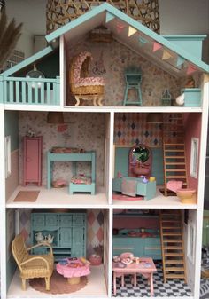 a doll house with furniture and accessories in it