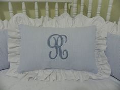 the monogrammed pillow has been made to look like it is in blue and white