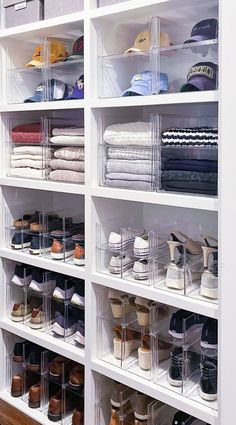 an organized closet with clear bins and shelves