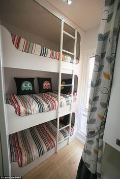 a bunk bed with two sets of pillows on it