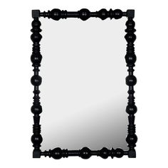 a mirror that is made out of wood and has black beads on the frame, along with a white background