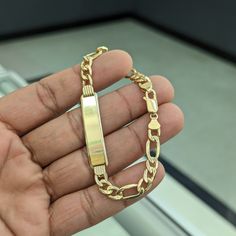 10kt Real Gold Figaro Id Bracelet Size 7.8 Inch Length Weight 7.26 Gm Link 7.1 Mm Wide Id Plate 1.55 Inch Long Id Plate 9.1 Mm Wide Please Check The Picture Carefully To Understand The Size Of The Thickness 100% Authentic Gold Not A Gold Filled Or Not A Gold Plated Never Change Color Or Never Fade Never Tarnish Comes In A Gift Box 14k Gold Figaro Chain Nameplate Jewelry, Yellow Gold Tarnish Resistant Nameplate Bracelet, Yellow Gold Tarnish-resistant Nameplate Bracelet, 14k Yellow Gold Nameplate Bracelet, 14k Gold Nameplate Bracelet For Formal Occasions, 14k Gold Nameplate Bracelets With Polished Finish, 14k Gold Nameplate Bracelet With Polished Finish, 14k Gold Formal Nameplate Bracelet, Tarnish Resistant Gold Nameplate Bracelet For Formal Occasions